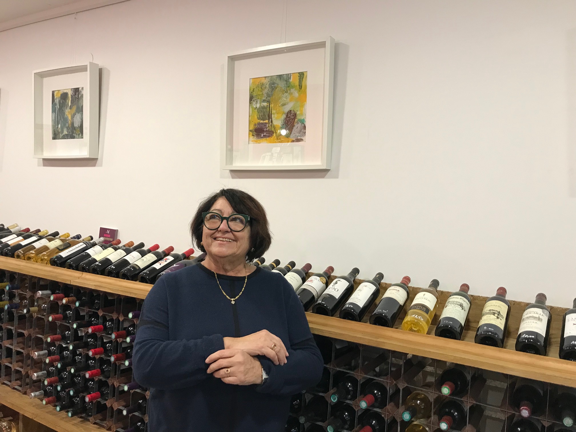 Person using a pen to cross a task off a productivity paper card.