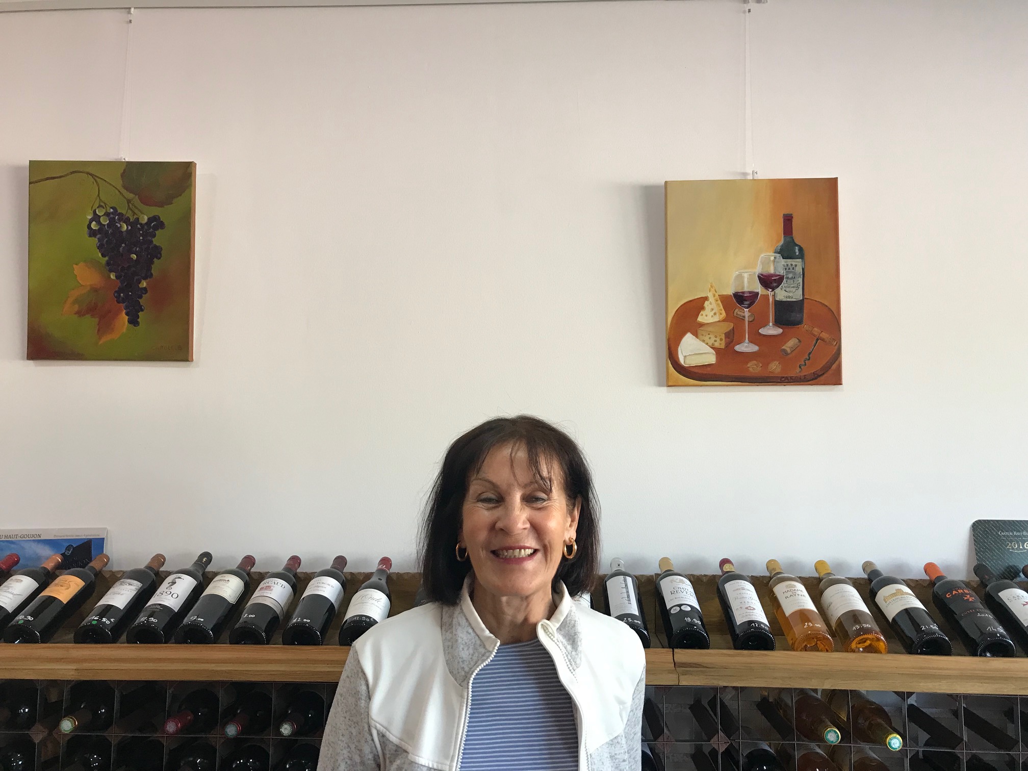 Person using a pen to cross a task off a productivity paper card.