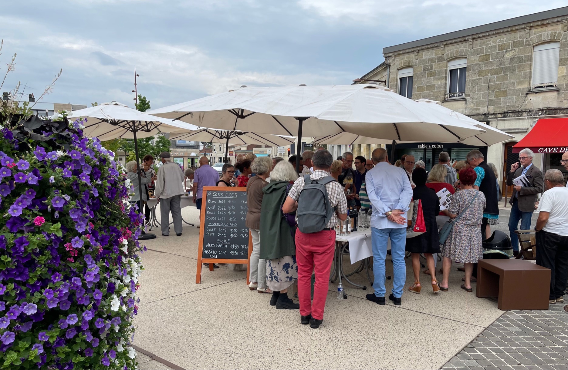 Person using a pen to cross a task off a productivity paper card.