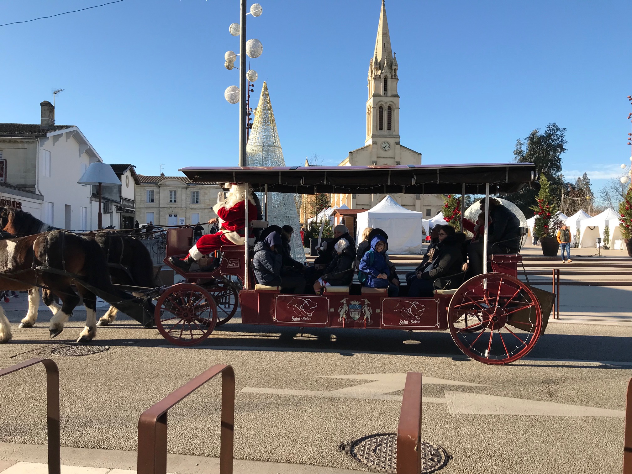 Person using a pen to cross a task off a productivity paper card.
