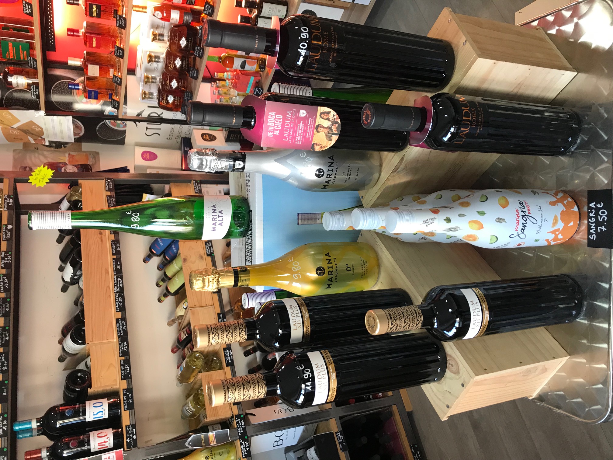 Person using a pen to cross a task off a productivity paper card.