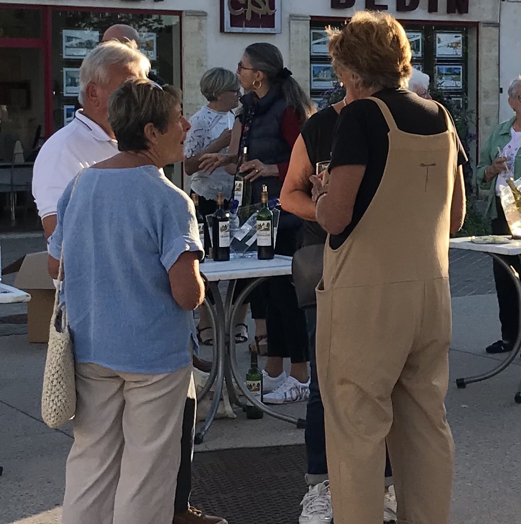 Person using a pen to cross a task off a productivity paper card.