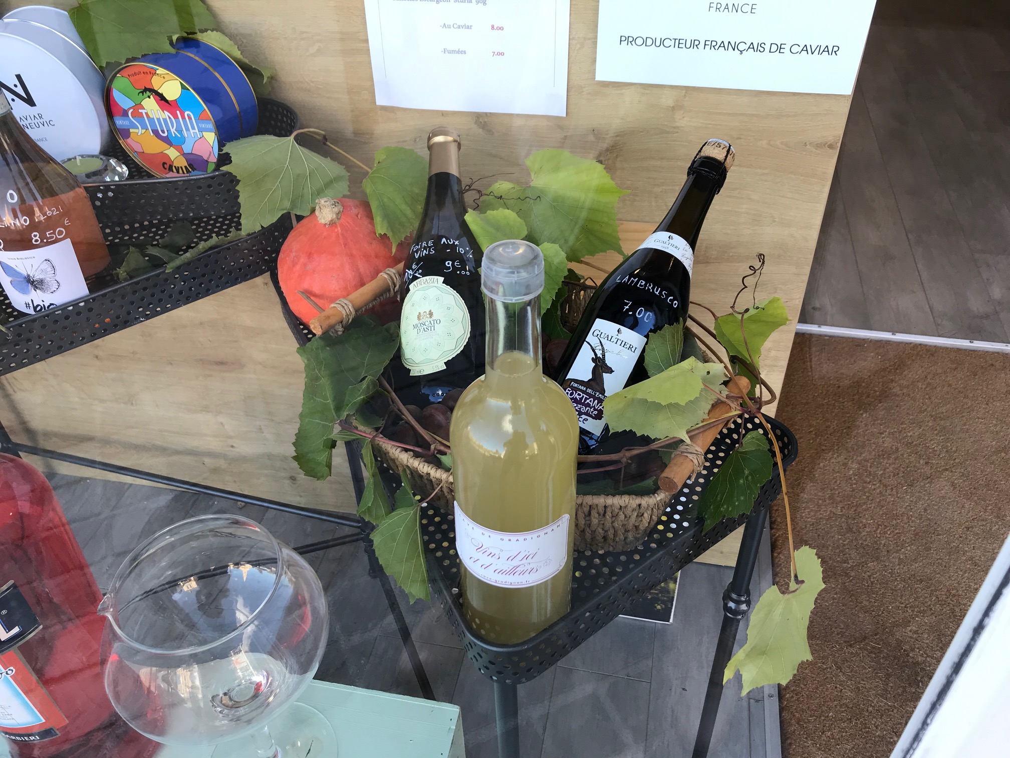 Person using a pen to cross a task off a productivity paper card.