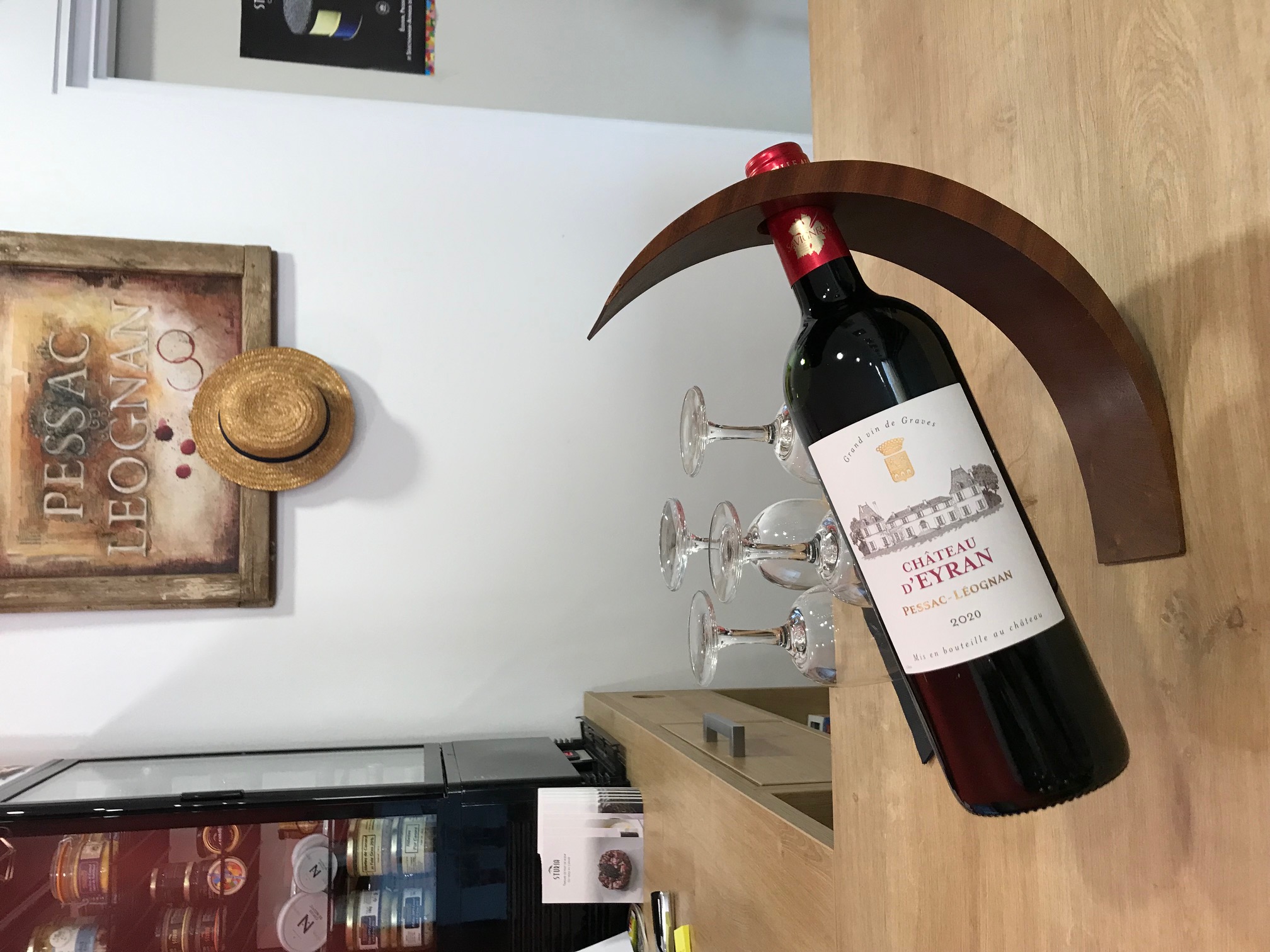 Person using a pen to cross a task off a productivity paper card.