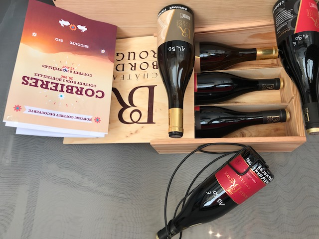 Person using a pen to cross a task off a productivity paper card.