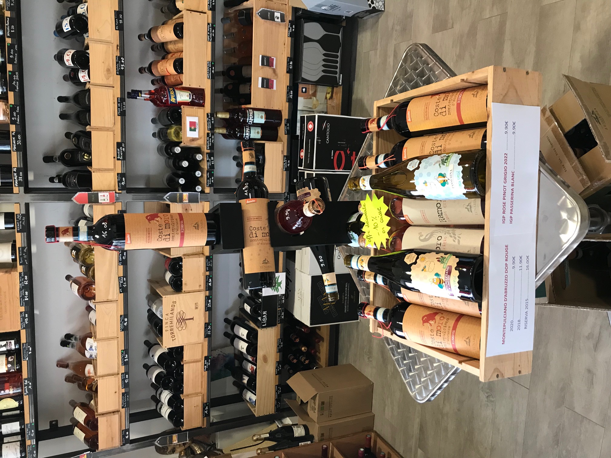 Person using a pen to cross a task off a productivity paper card.