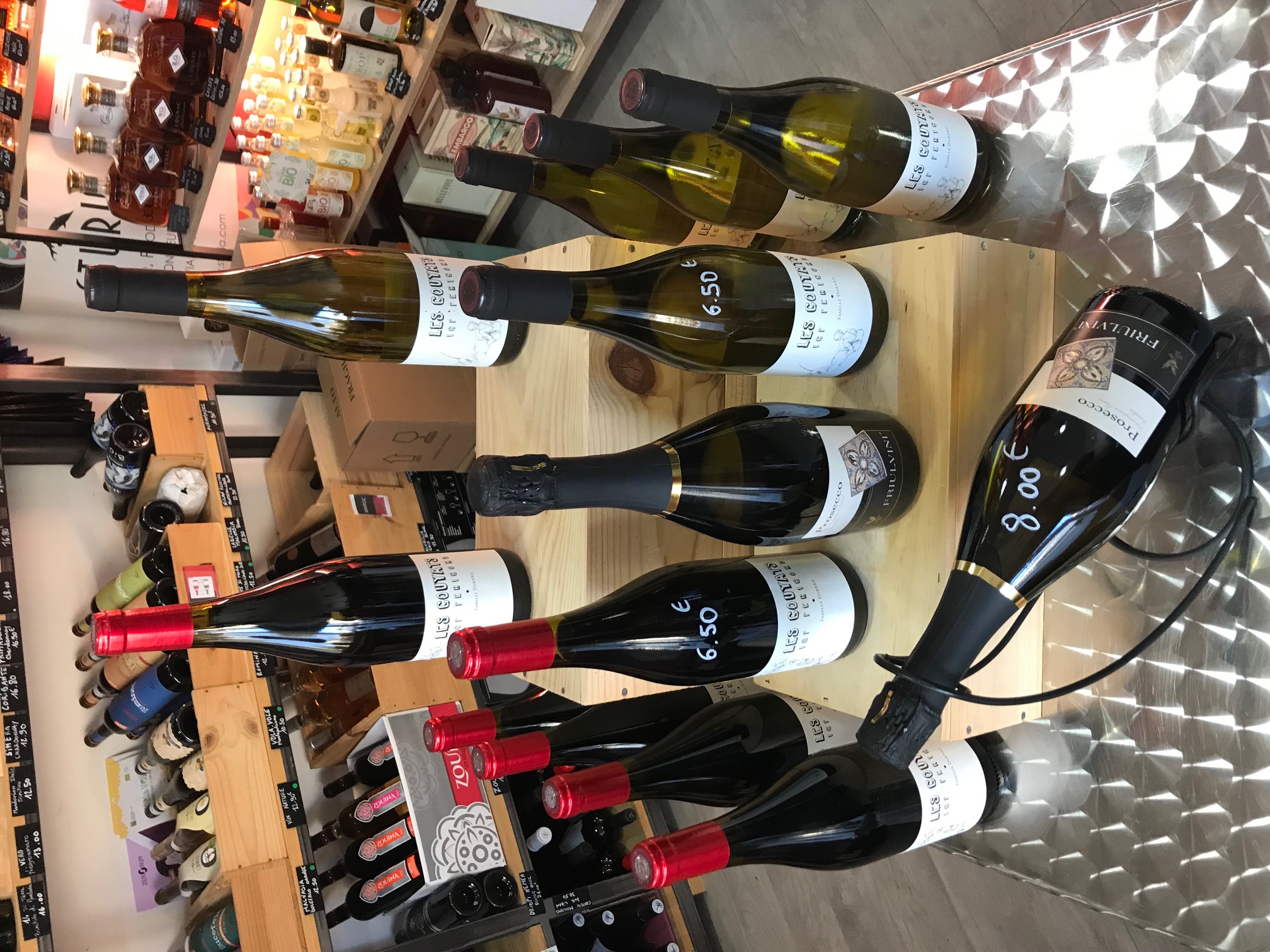 Person using a pen to cross a task off a productivity paper card.