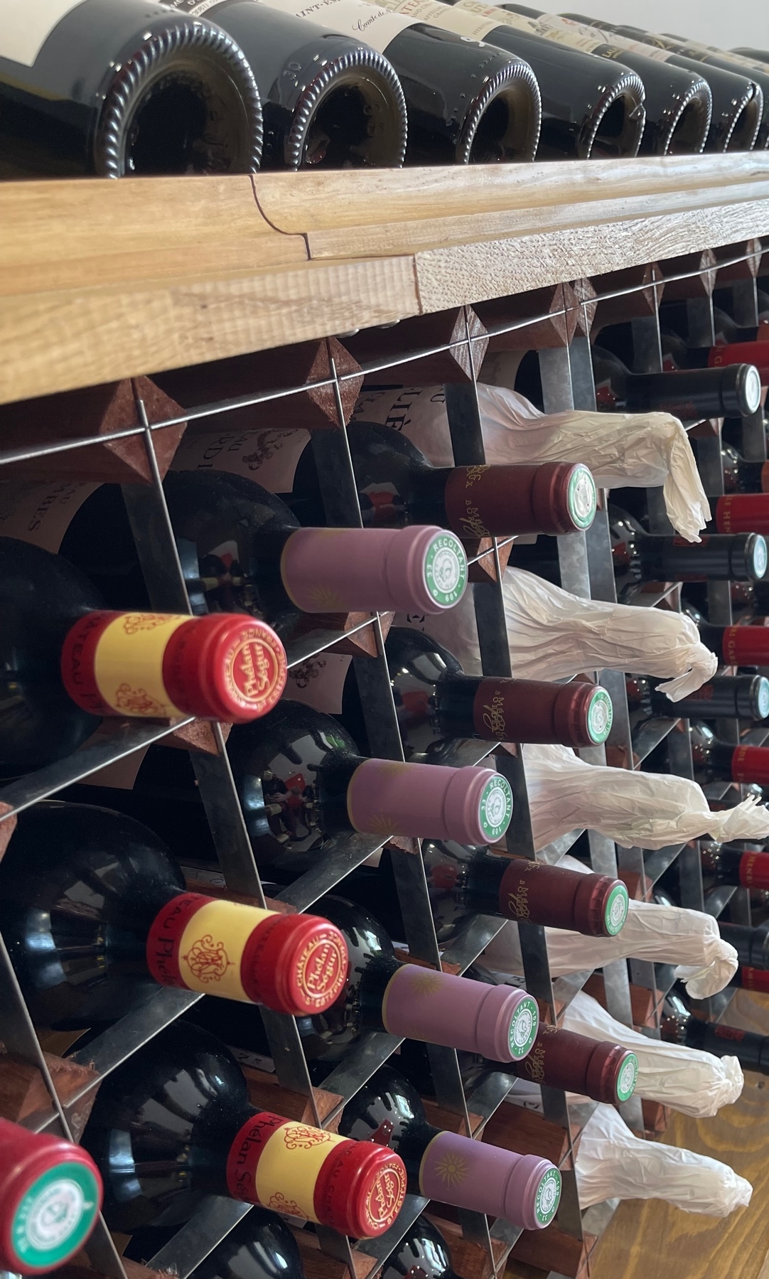 Person using a pen to cross a task off a productivity paper card.