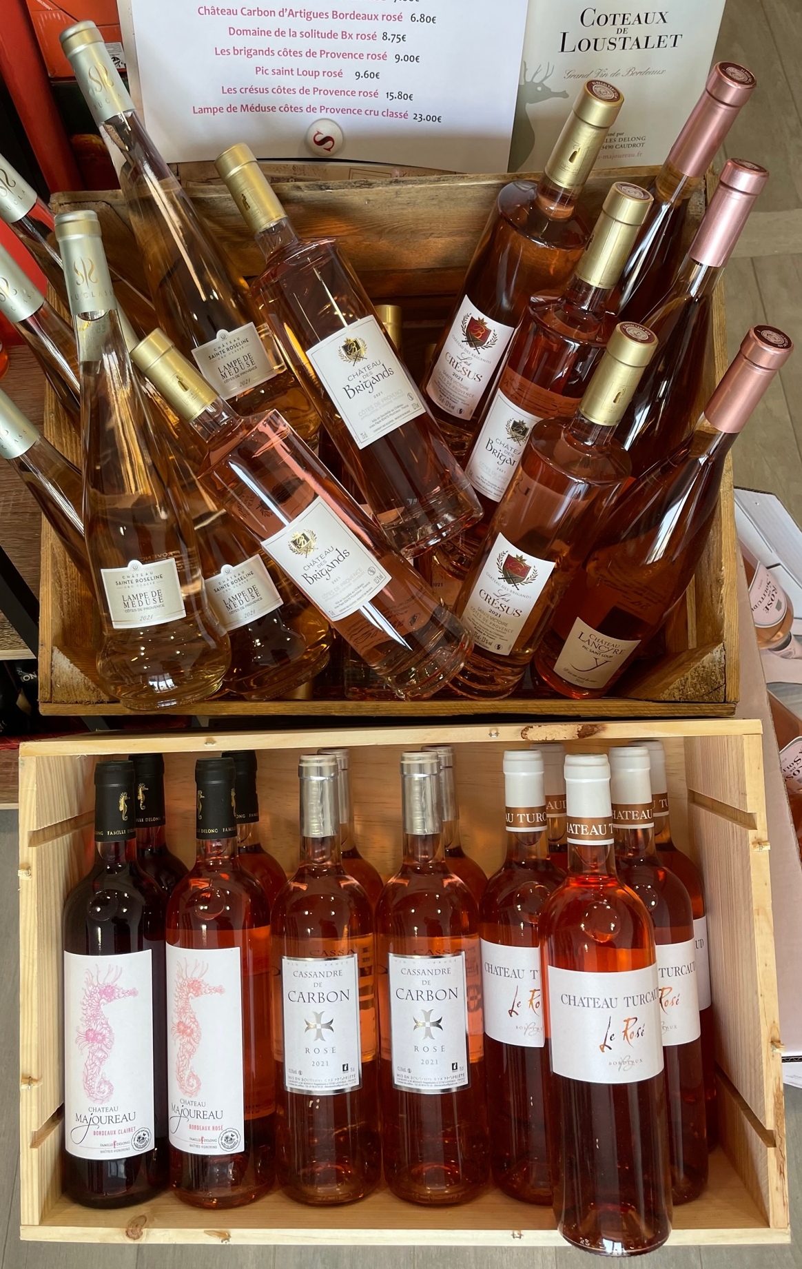 Person using a pen to cross a task off a productivity paper card.